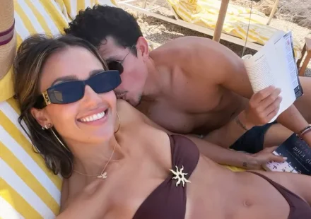 Jessica Alba and Danny Ramirez relaxing together on a beach during their Italian getaway.
